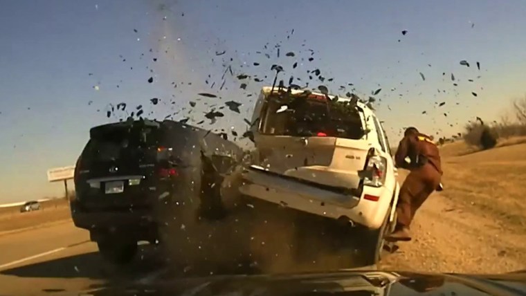 Video: SUV slams into vehicle during traffic stop