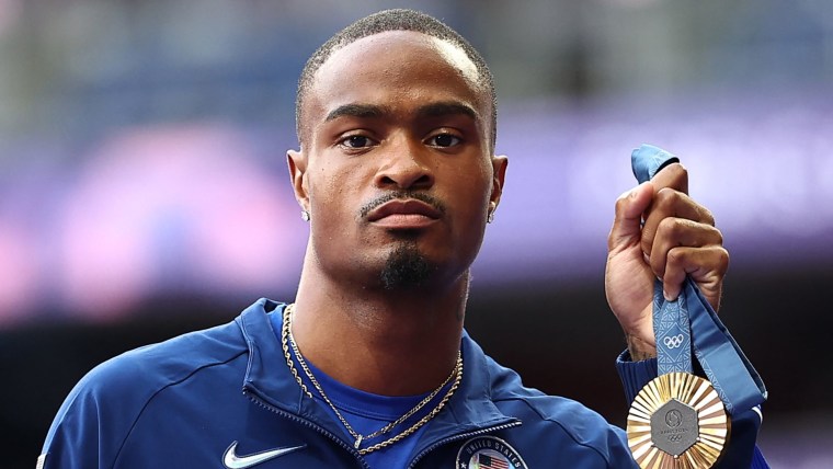 Quincy Hall receives gold medal after electric 400m comeback