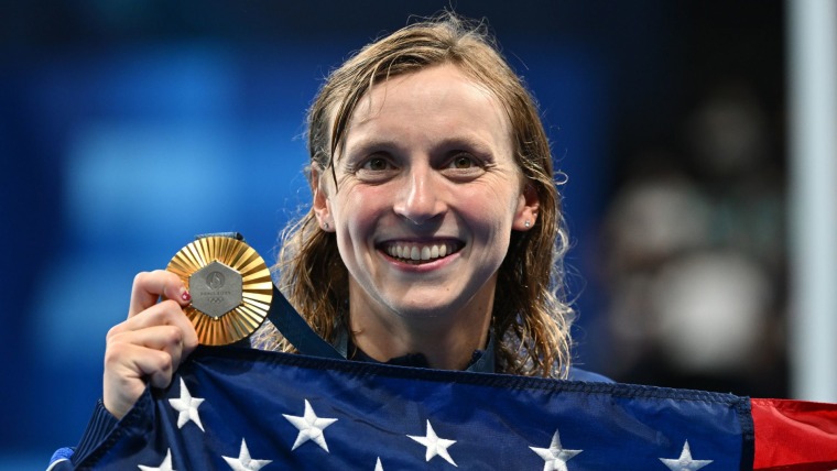 Katie Ledecky talks with Mike Tirico after historic Games