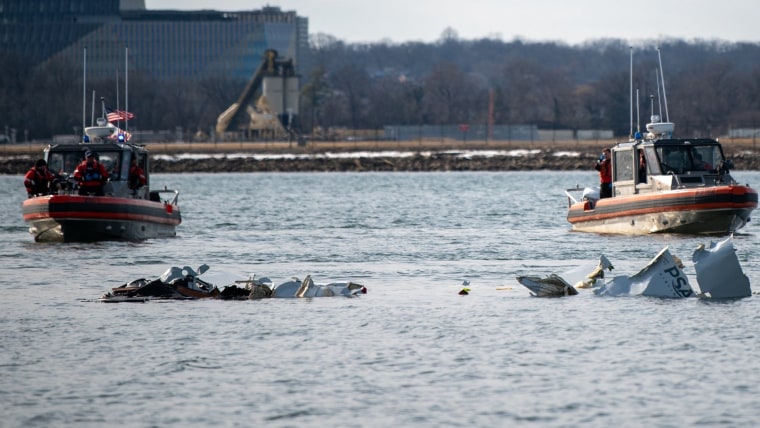 Investigators work to recover wreckage from DC plane crash