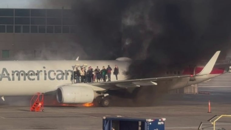 American Airlines plane catches fire at Denver International Airport