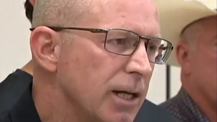 Police officer asks people to avoid - 1752080190900 F Vert Police Avoid Flood Zones 250709 720x1280 X2u6hw 