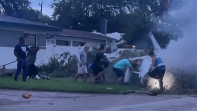 Residents rescue survivors after small plane crashes into neighborhood