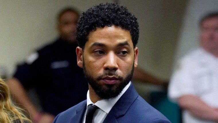 Jussie Smollett stands in a courtroom