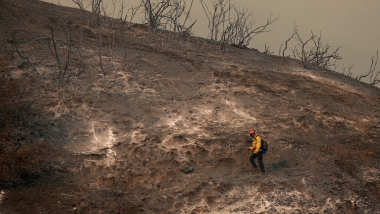 Image: Powerful Winds Fuel Multiple Fires Across Los Angeles Area firefighter hillside palisades fire