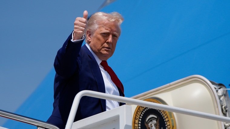 Donald Trump with thumbs up as he boards Air Force One