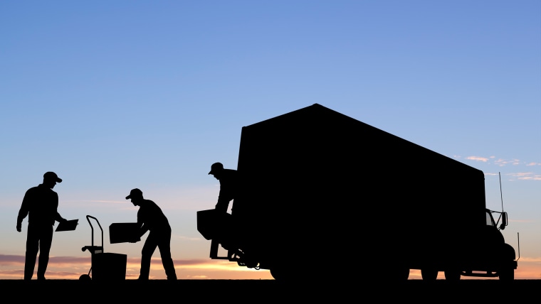 Moving Day workers unload a truck silhouette