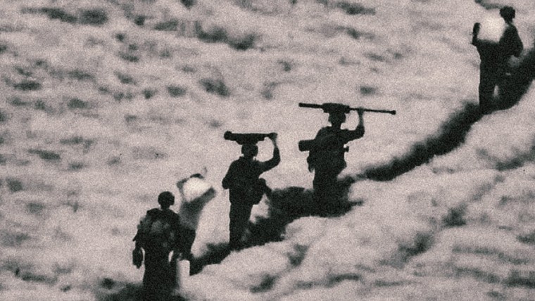 Rwanda military soldiers carry weapons.