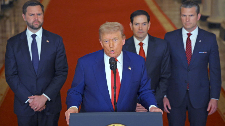 Trump addresses the nation from a lectern at the White House.