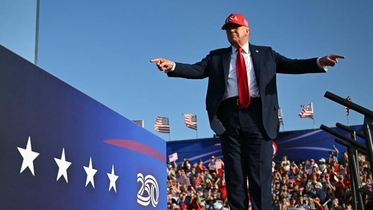 Image: donald trump politics political politician des moines iowa red maga hat