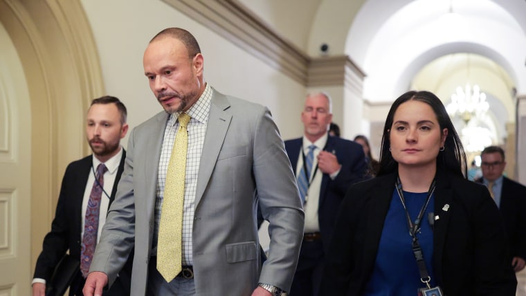 Dan Bongino walks in the Capitol.