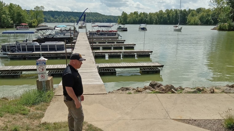 skid marks that were left on a sidewalk when a woman drove a golf cart into Atwood Lake