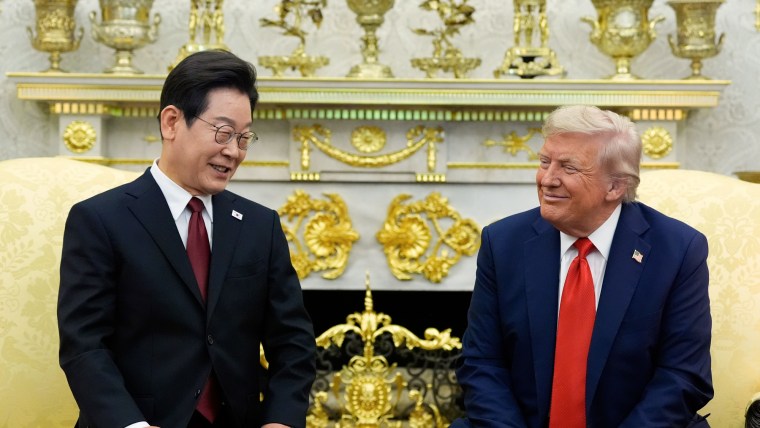 Lee Jae Myung, left, and Donald Trump sit in chairs in the Oval Office