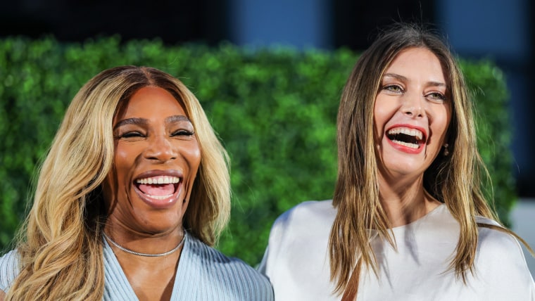 Serena Williams, left, and Maria Sharapova smile next to each other