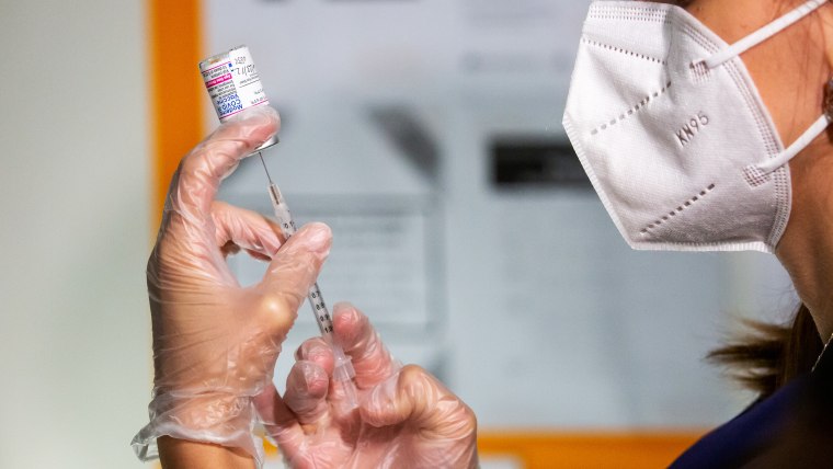 A healthcare worker prepares a dose of a Covid-19 vaccine