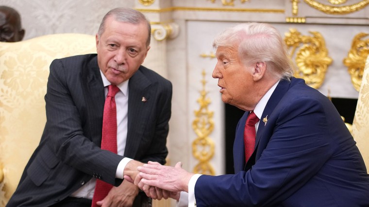 President Donald Trump shakes hands with President of Turkey Recep Tayyip Erdogan during a meeting in the Oval Office at the White House on September 25, 2025.