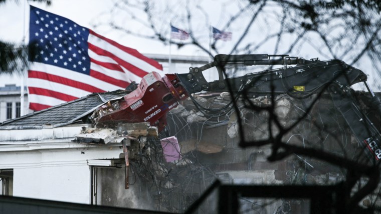 Heavy machinery tears down a section of the East Wing of the White House