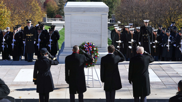 Vice President JD Vance, second from right, and President Donald Trump salute during a wreath-laying ceremony at The Tomb of the Unknown Soldier 