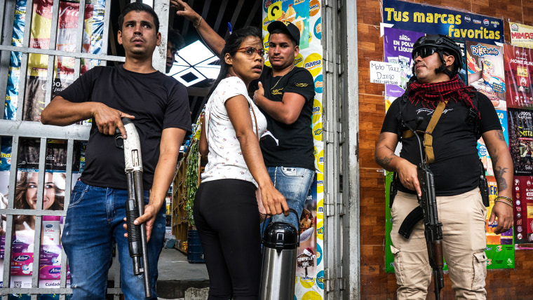 Armed groups patrol markets in Caracas