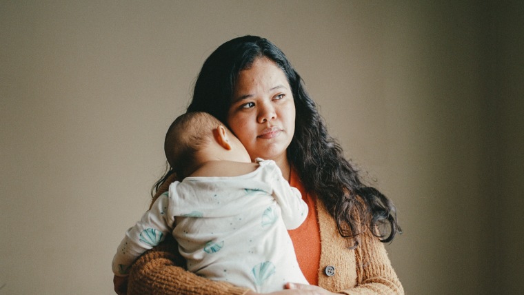 Maria Ibarra holds her baby