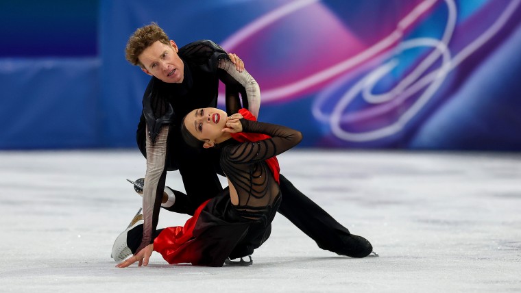 Madison Chock and Evan Bates of Team U.S. figure skating on ice at the Milano Cortina 2026 Winter Olympics