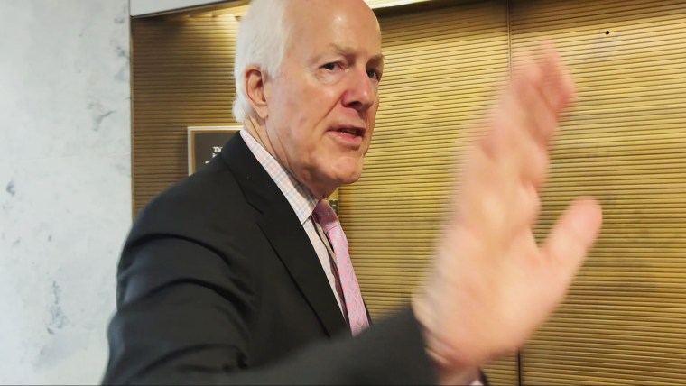 Sen. John Cornyn, R-Texas, reacts to a reporter's question at the Capitol on March 11, 2026.