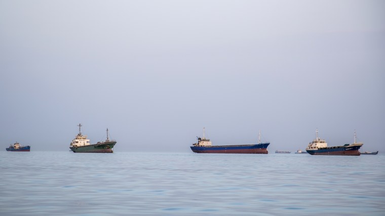 Ships are anchored near the shoreline in Bandar Abbas, Iran.