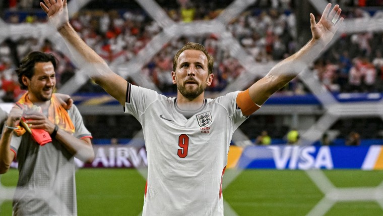 Harry Kane celebrating on the soccer field.
