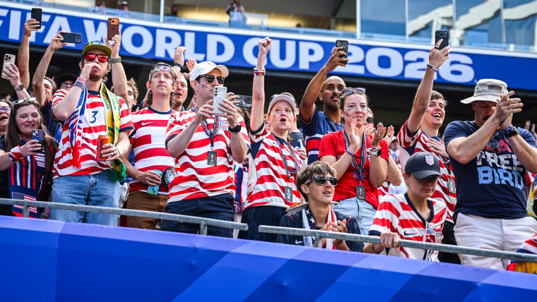 Fans of USA cheer their team from the stands