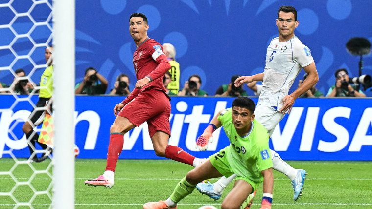 Cristiano Ronaldo reacts as he scores his team's third goal