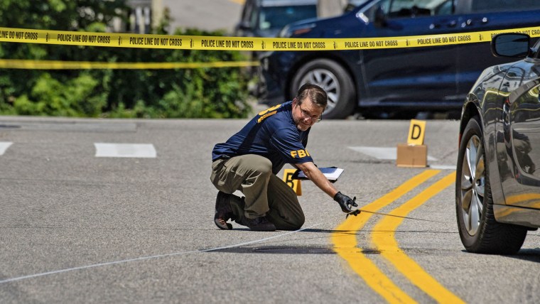 FBI investigators work the scene of an ICE-involved shooting in Biddeford, Maine