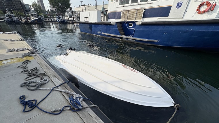 The capsized Vessel, tied to a pier after the capsizing, on Aug. 8, 2026.