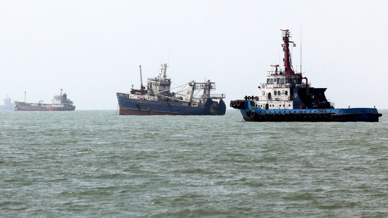 Three ships in a row on the water
