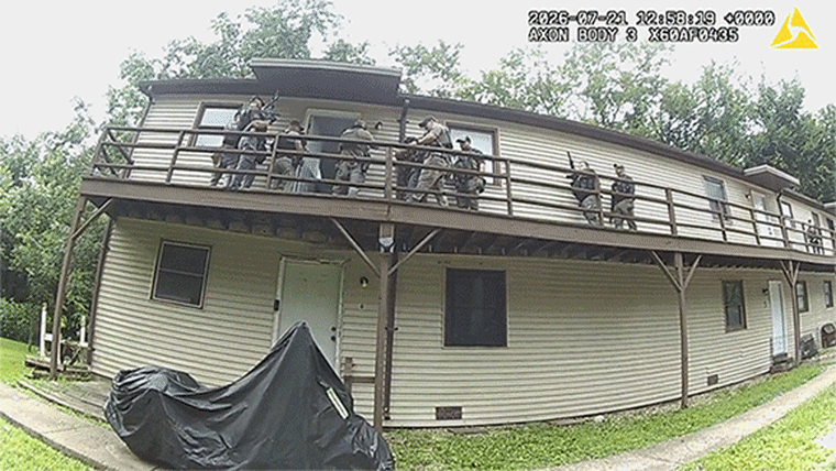 A deck begins to give way as U.S. Marshals conduct an operation in Missouri.