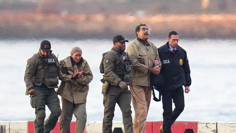 Nicolas Maduro and his wife, Cilia Flores, in handcuffs