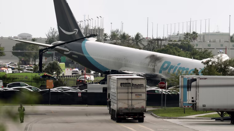 Amazon Cargo Plane tilted on its side off an airport tarmac