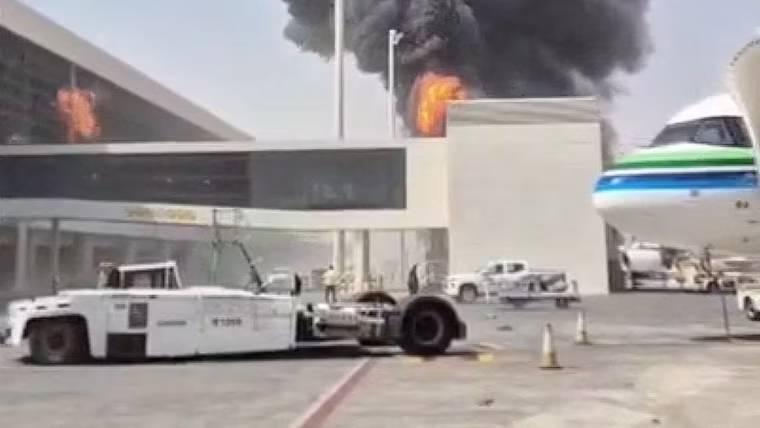 Smoke and flames rise from King Khalid Airport, after Yemen's Iran-backed Houthis said they attacked the airport, in Riyadh