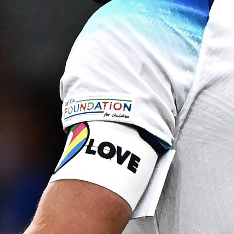 England's forward Harry Kane wearing a rainbow armband at the San Siro Stadium in Milan. On Sept. 24, 2022.  England, Germany and five other European teams at the World Cup on Monday, November 21, abandoned plans to wear a rainbow-themed armband in support of LGBTQ rights, citing the threat of disciplinary action from FIFA. The "OneLove" armband due to be warn by the likes of England captain Harry Kane and Germany counterpart Manuel Neuer is designed as part of a campaign to promote inclusivity. 