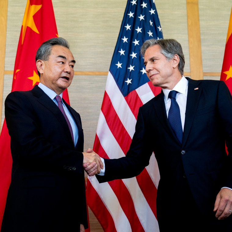 Secretary of State Blinken, right, shakes hands with China's Foreign Minister Wang Yi during a meeting on the Indonesian resort island of Bali on July 9, 2022.