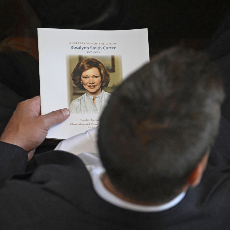 An attendee holds a program prior to a tribute service for former first lady Rosalynn Carter at Glenn Memorial Church in Atlanta on Nov. 28, 2023.