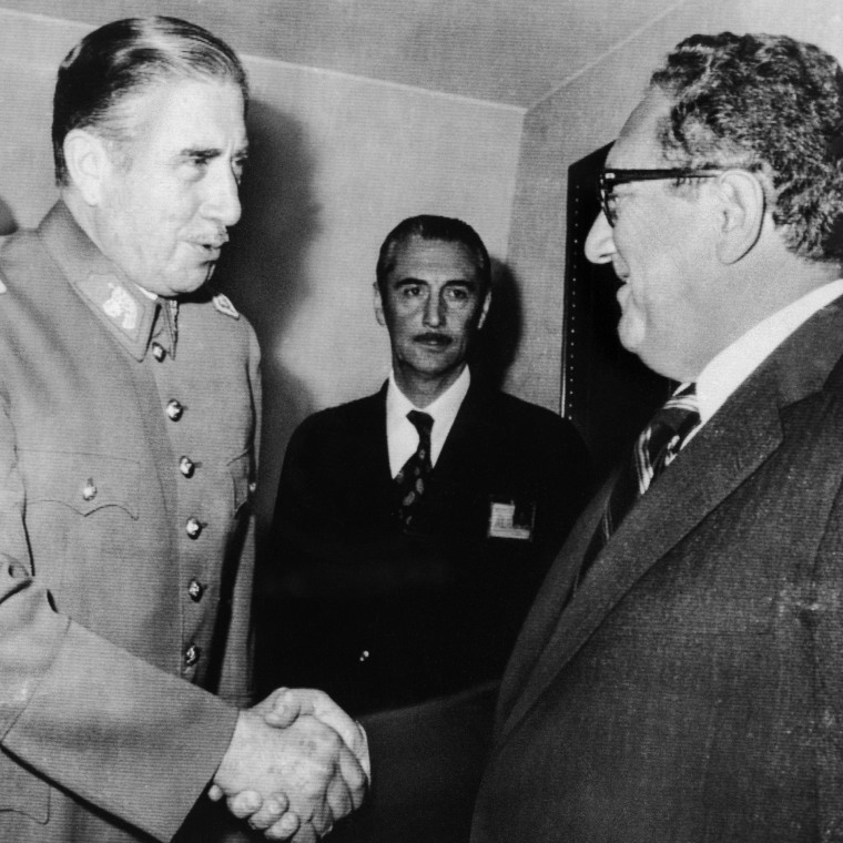 Chilean President Augusto Pinochet greets Secretary of State Harry Kissinger on his arrival at the President's office on June 8, 1976 . 