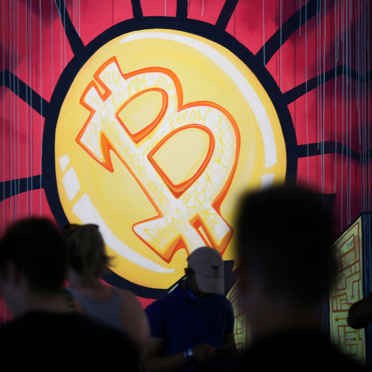 Image: A banner with the logo of bitcoin is seen during the crypto-currency conference Bitcoin 2021 Convention at the Mana Convention Center in Miami,