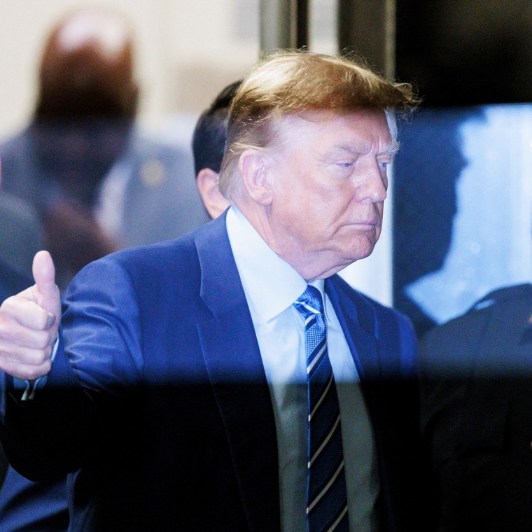 Donald Trump gives the thumbs-up as he returns to the courtroom