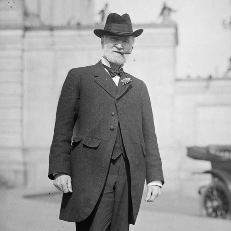 Joseph G. Cannon poses for a photograph with a cigar.