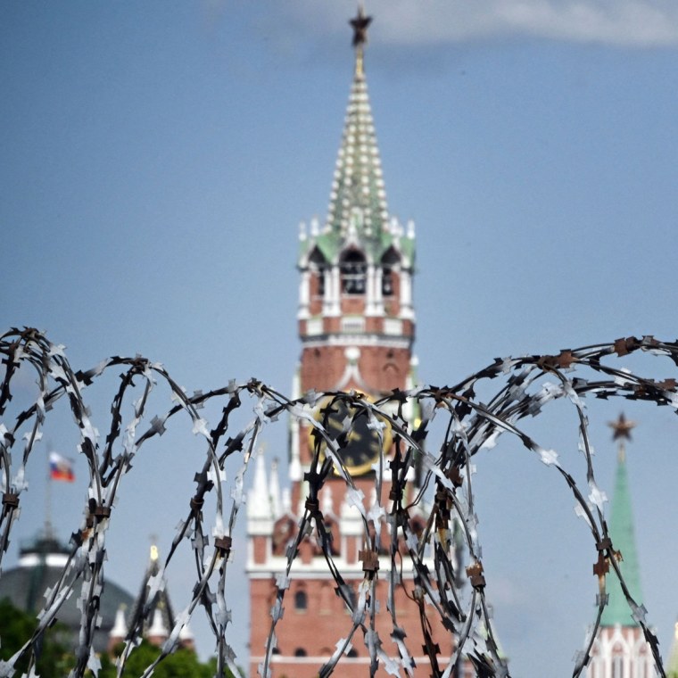 View of the Kremlin through the barbed wire of a municipal technical facility in Moscow