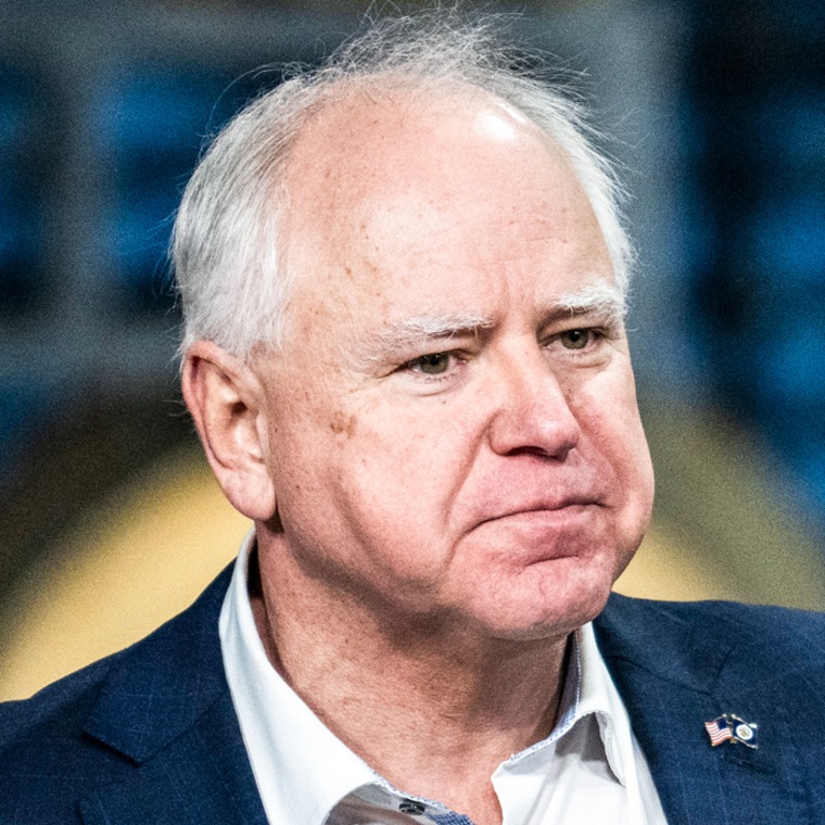 Tim Walz speaks, holds up thumb