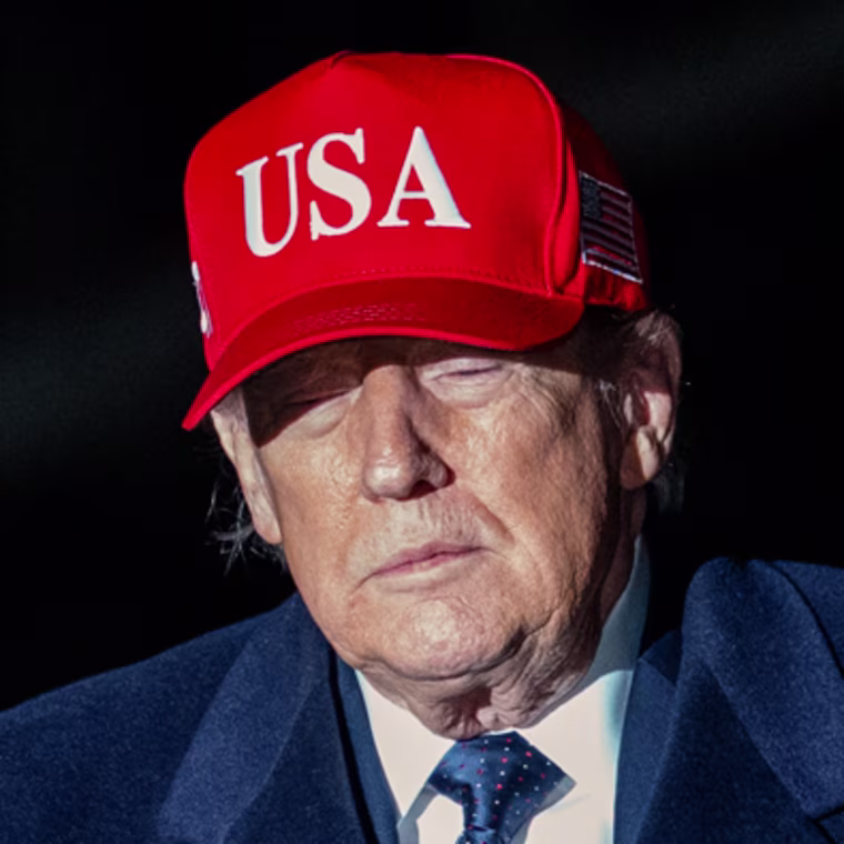 Donald Trump walks outside at night