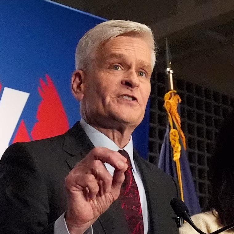 Image: Sen. Bill Cassidy, R-La., left, speaks to supporters alongside his wife, Laura, during an election night watch party.