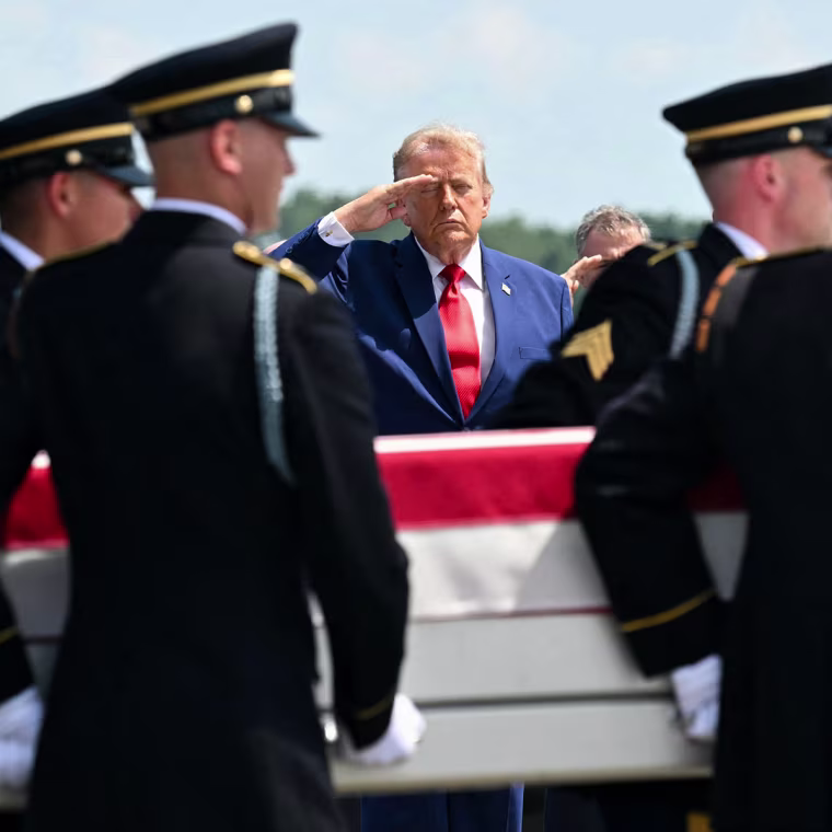 President Donald Trump salutes as a U.S. Army carry team carries the flag-draped transfer case containing the remains of 1st Lt. Tyler James Feehan, 25, of Ewa Beach, Hawaii, at Dover Air Force Base in Dover, Del., on July 22, 2026.