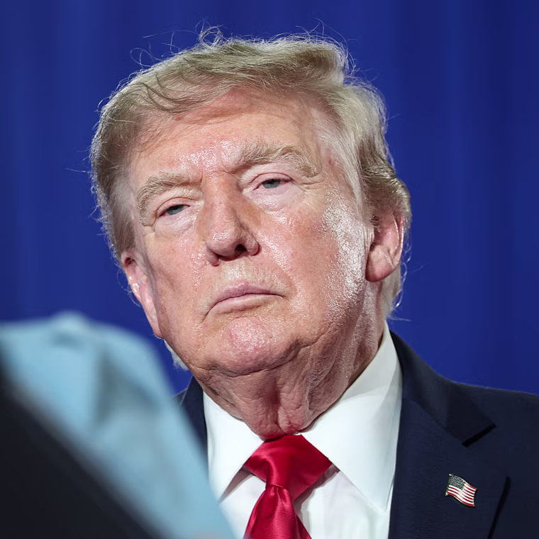 U.S. President Donald Trump listens to U.S. Sen. Darline Graham speak